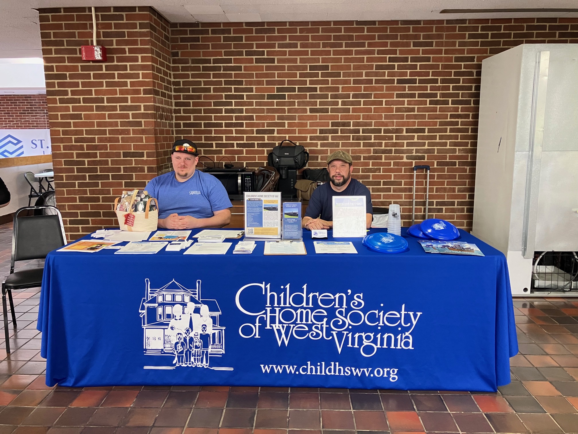 Housing expo attendees walking through partner booths