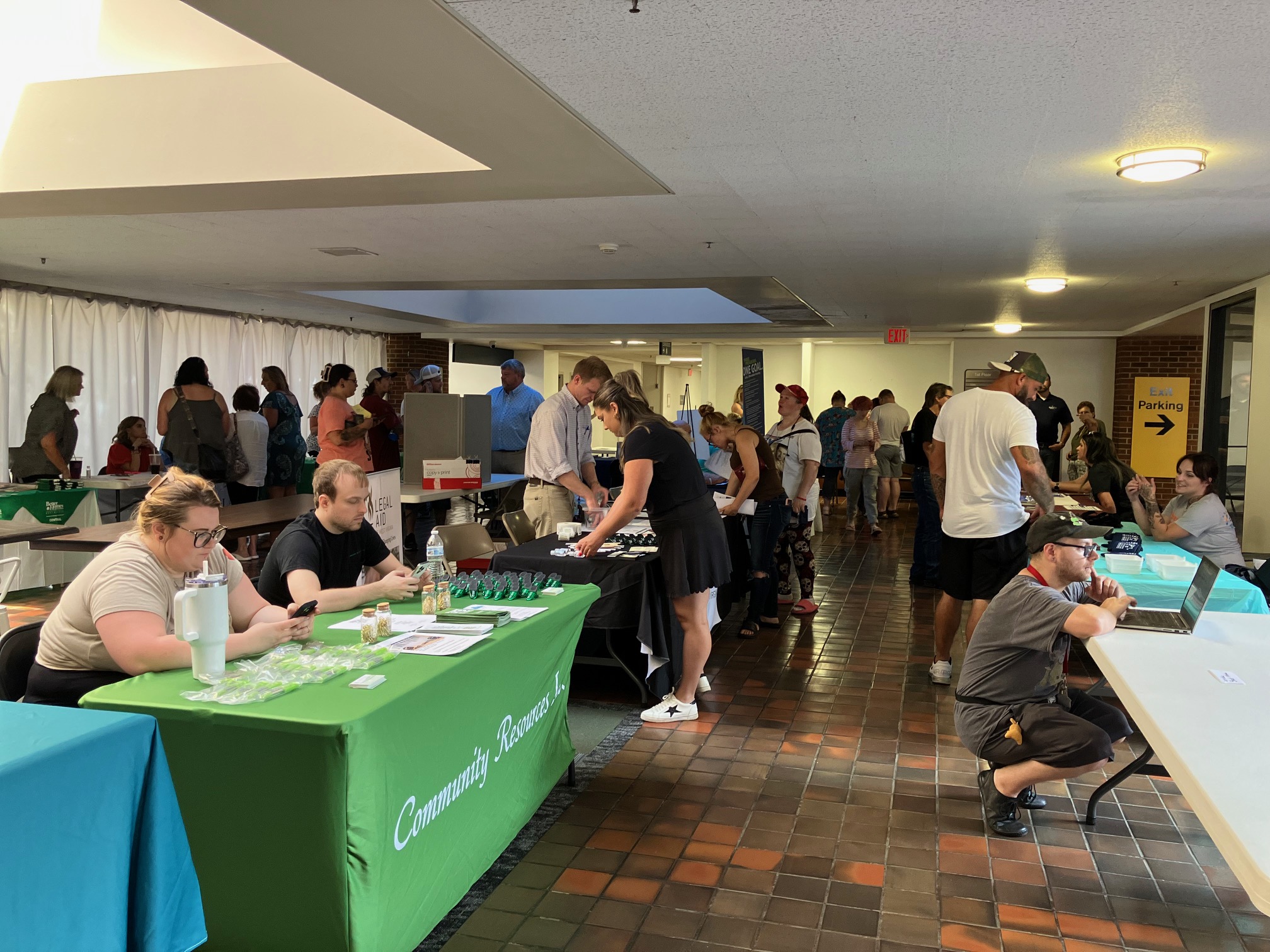 Residents gathering in the lobby area during the expo