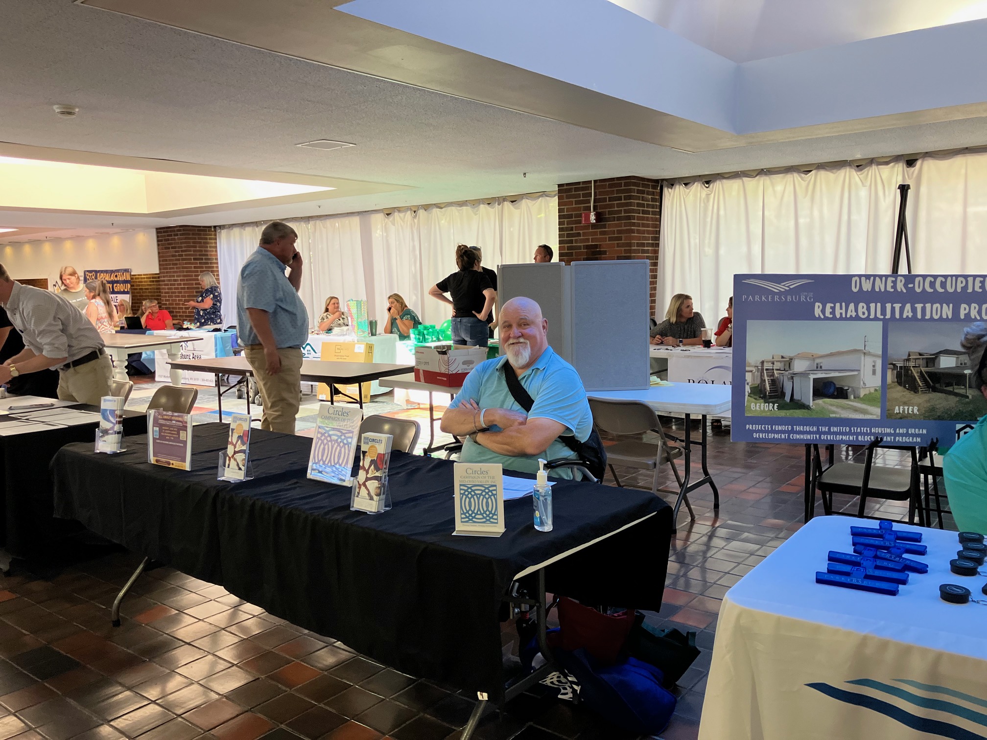 Expo participants talking with lenders and agency representatives